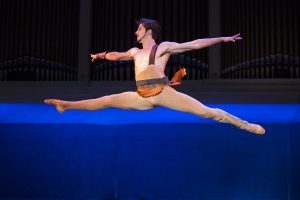Iago Bresciani dances in the movement "Spartacus" at the Charlotte Ballet's performance An Evening of Pas de Deux on Wednesday, July 27, 2016, in the Amphitheater. Photo by: Mike Clark