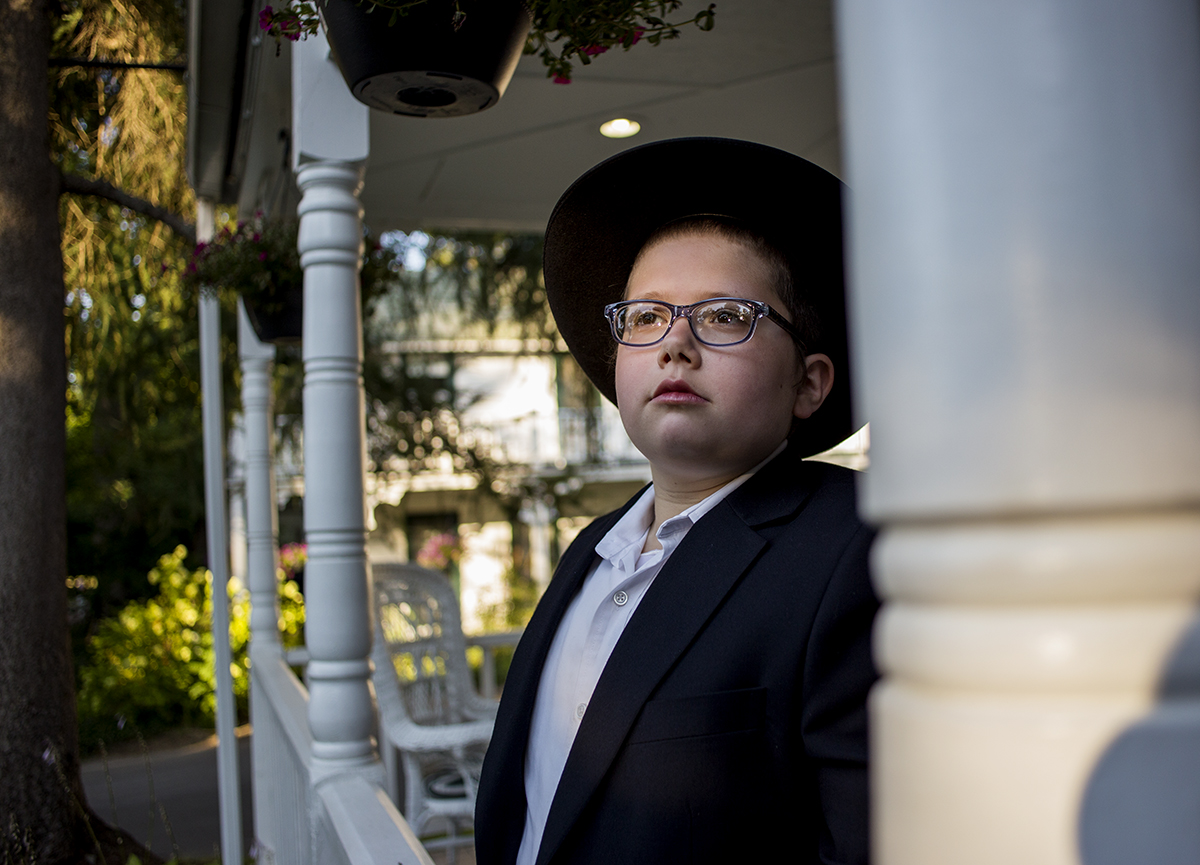 Shmuel Vilenkin, 12, stands outside the Chabad Lubavitch house August 2, 2016.