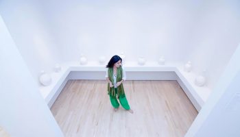 Raheleh Filsoofi stands with her installation piece _Only Sound Remains,_ 2014_