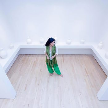 Raheleh Filsoofi stands with her installation piece _Only Sound Remains,_ 2014_