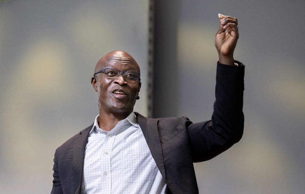 Conrad Tucker, director of CMU-Africa and commissioner of the U.S. Chamber of Commerce Artificial Intelligence Commission on Competitiveness, Inclusion, and Innovation, uses Scrabble to explain generative AI during his lecture Tuesday in the Amphitheater.
