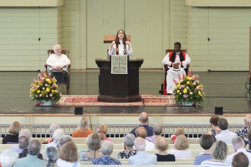The Rev. Leyla King, canon for mission of the Episcopal Diocese of West Texas, opens her Week Four chaplaincy Sunday in the Amphitheater. 