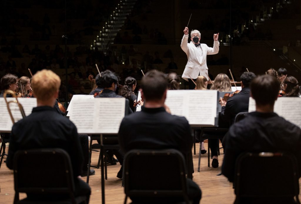 Artistic Director Timothy Muffitt conducts the Music School Festival Orchestra in Mahler’s Symphony No. 5 during their final concert of the season Aug. 7, 2023, in the Amphitheater. 
