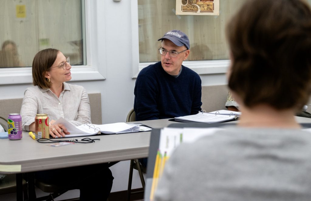 Ziegler, left, and director David Auburn discuss a scene during a table read of Celebrating Sixty-Five Years of the Ladies Journal of Cambridge, Massachusetts!
