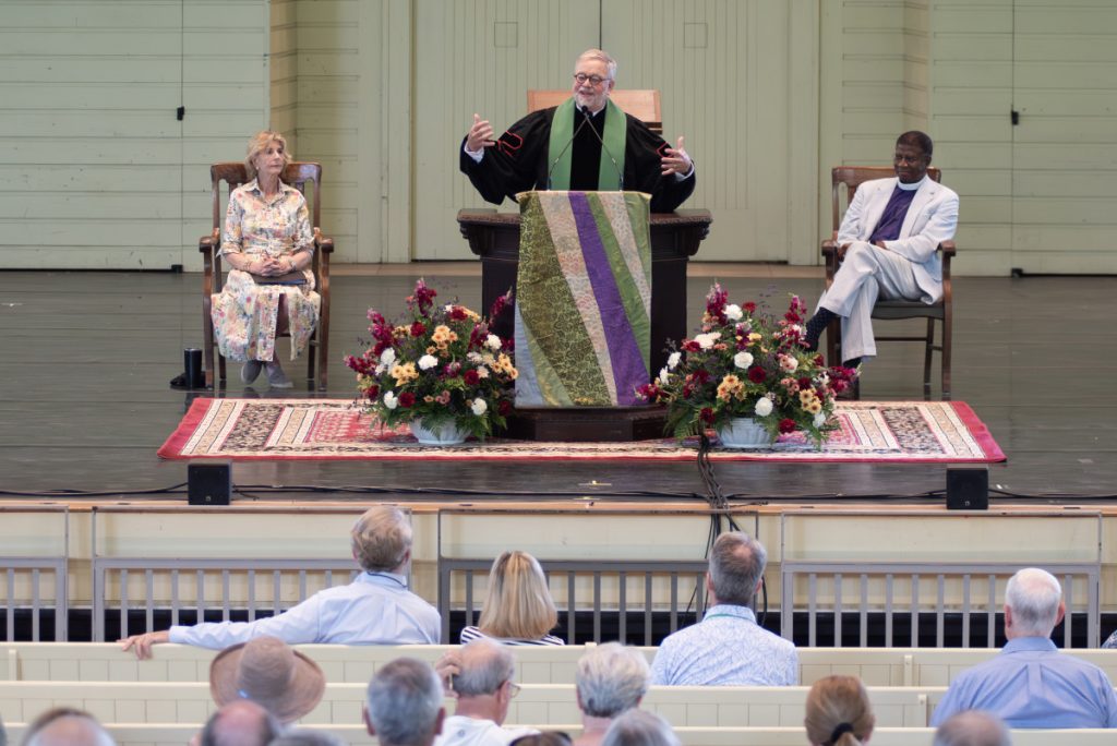 The Rev. J. Peter Holmes delivers his sermon during morning worship Sunday in the Amphitheater.