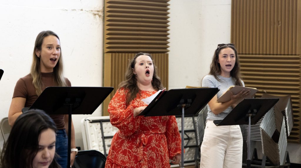 GABRIEL MILBY / STAFF PHOTOGRAPHER From left, SarahAnn Duffy, mezzo-soprano, Faith Adams, soprano, and Sydney Dardis, soprano, practice Tuesday for their performance of ‘Sarah in the Theatre’ Tuesday in Jane A. Gross Opera Center.
